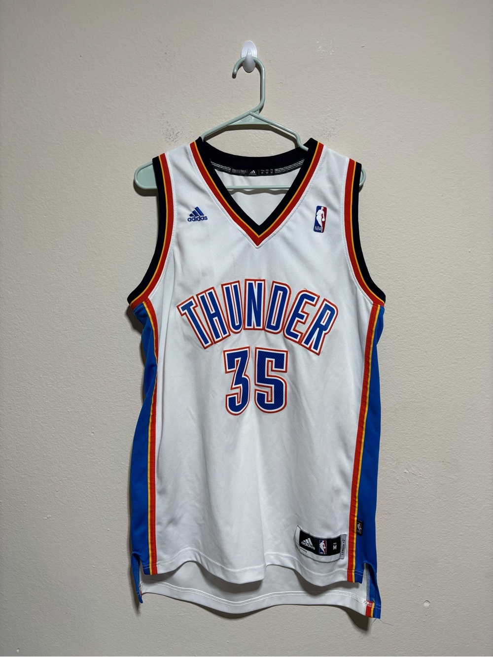 adidas White Thunder #35 Basketball Jersey with Blue and Orange Trim